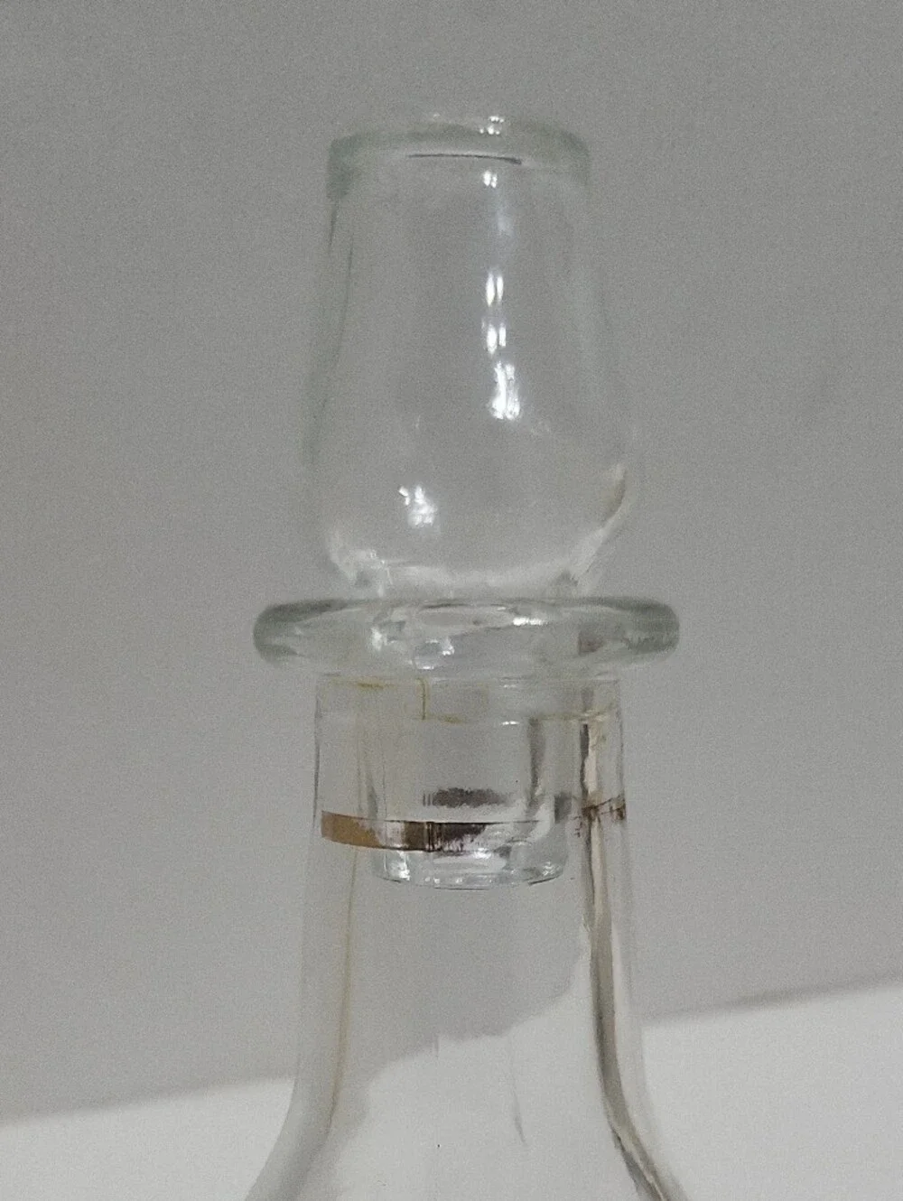 Clear Glass Decanter with Gold Accent and Leaf Etching.